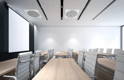 Training room with a projection screen and ceiling loudspeakers